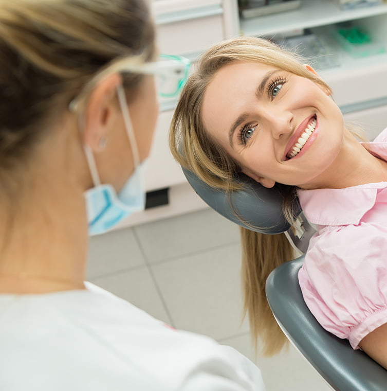 dental assistant working on patient