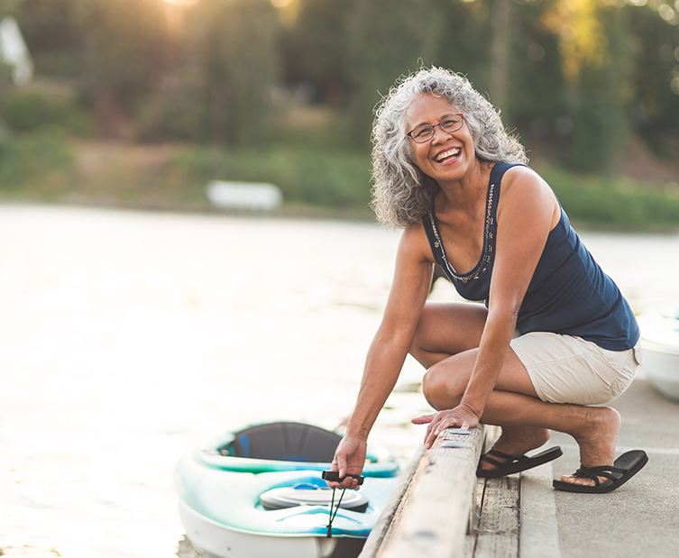 senior woman with kayak