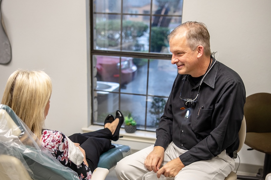 Dr. Paul Froude meeting with a dental patient in personalized dental care visit