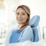 woman in dental chair asking how long do dental fillings last