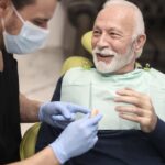 man getting dentures, learning how to eat with dentures